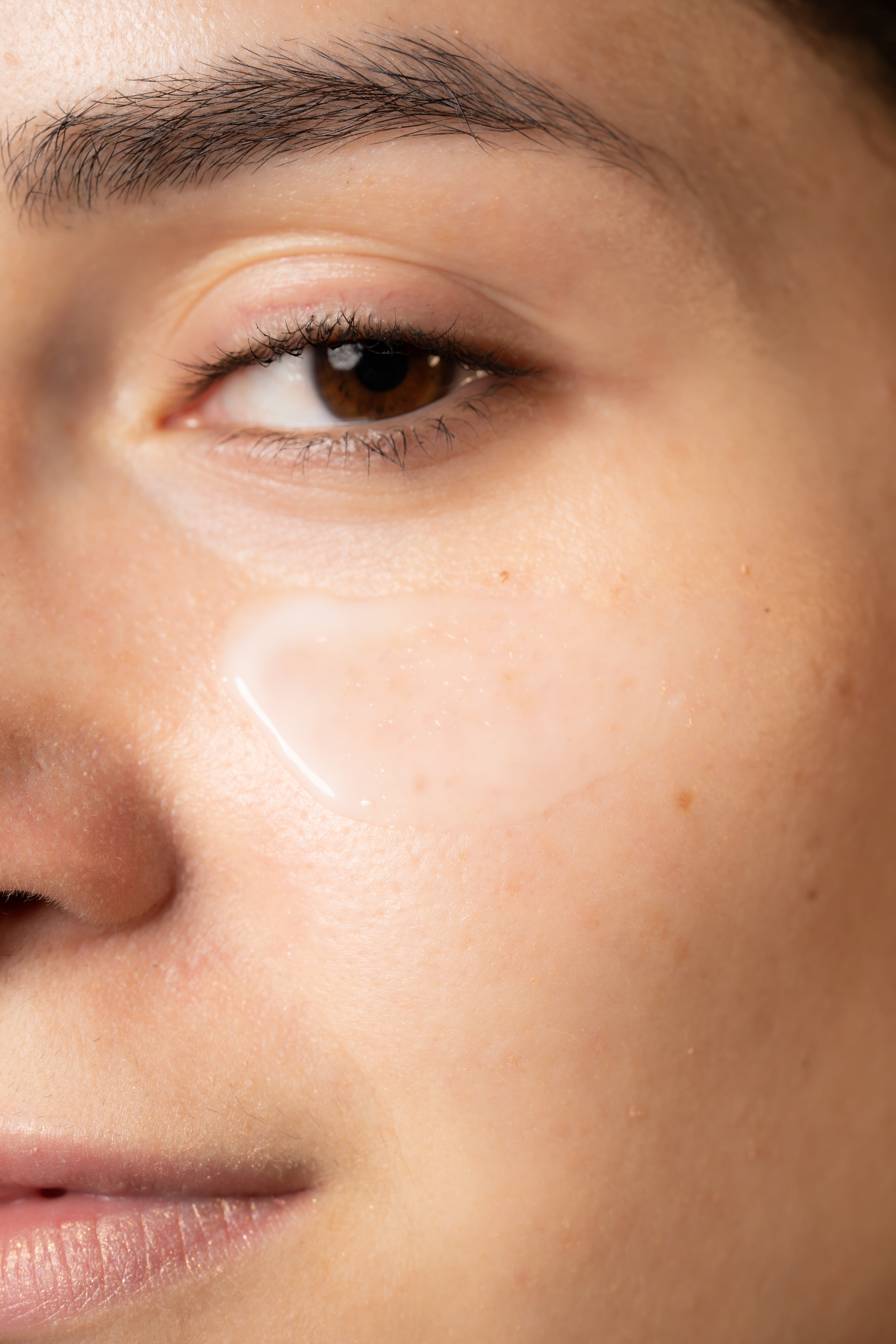 Close-up of a person applying Divina&