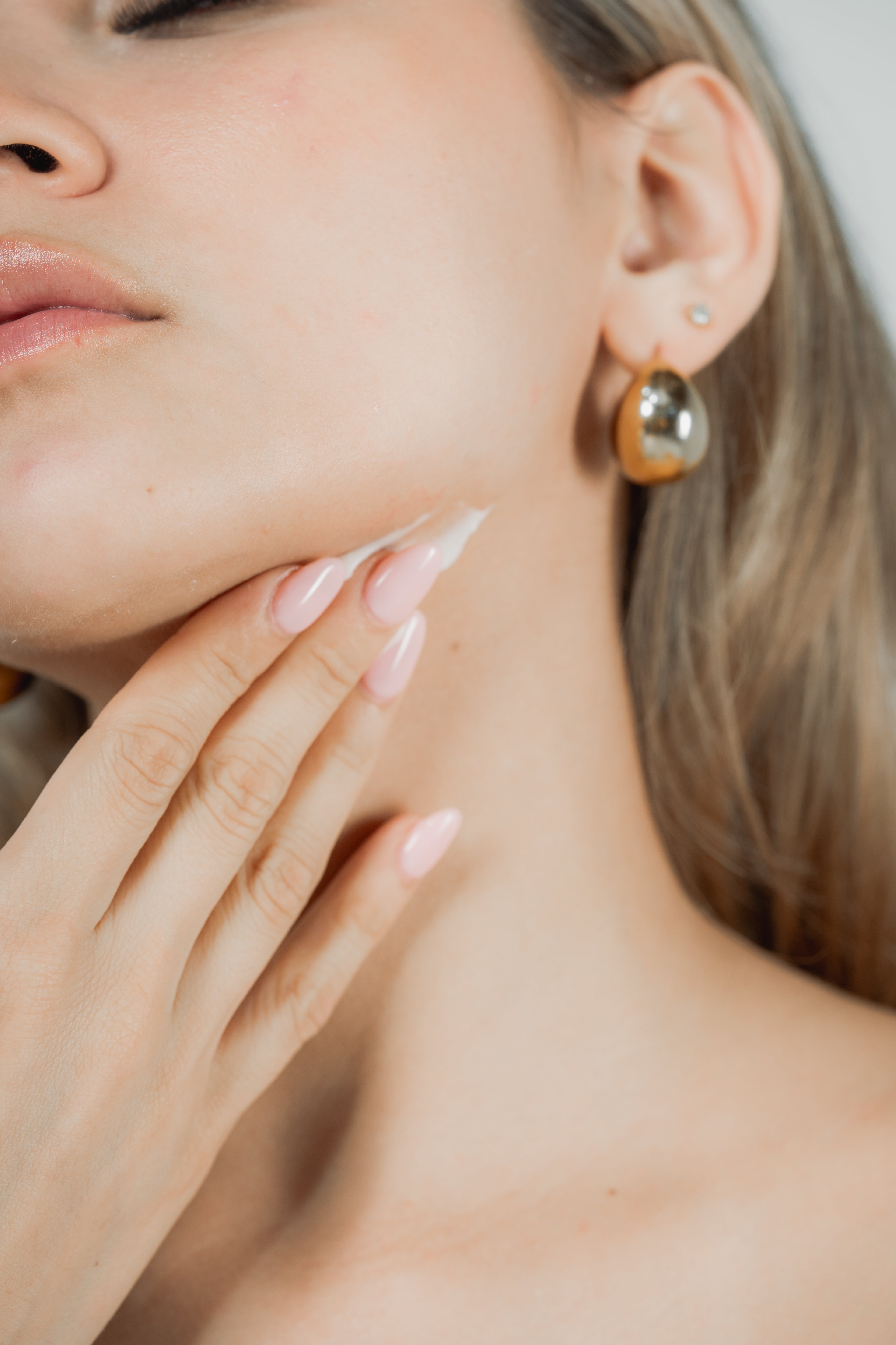 Close-up of a person applying Divina&