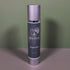 A silver and grey bottle of Divina Oxygen Toner stands upright on a flat surface against a muted green background, delivering intense hydration to support your skin barrier.
